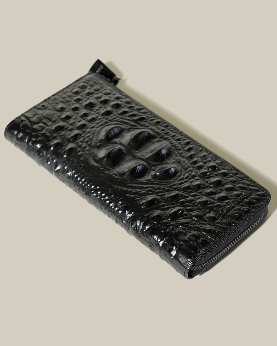 portefeuille zippé en peau de crocodile